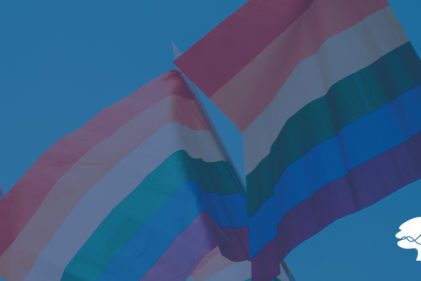 rainbow flag against blue sky