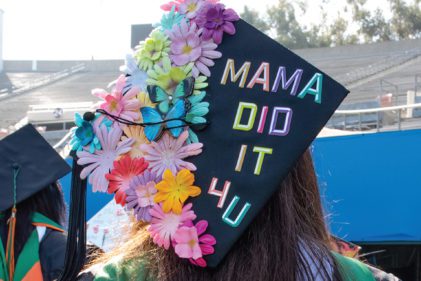 Graduate with cap says Mama did it for you