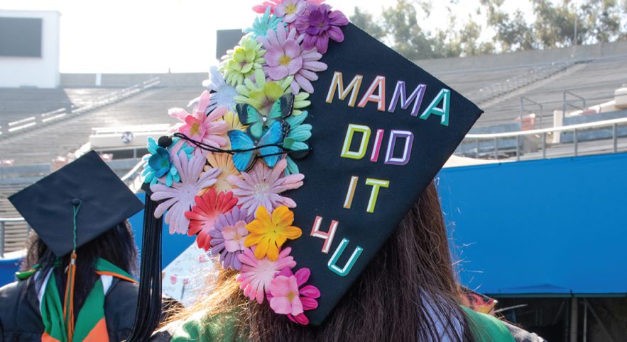 Graduate with cap says Mama did it for you