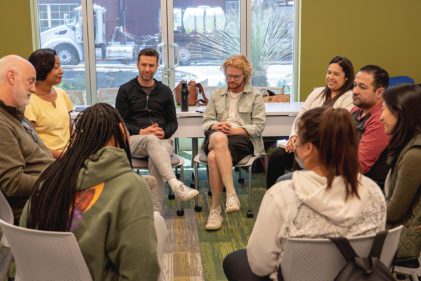 Pacific Oaks students in a circle during class