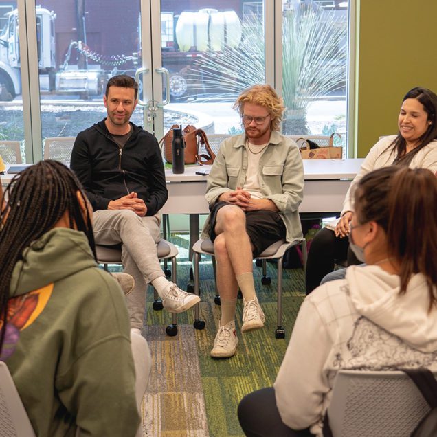 Pacific Oaks students in a circle during class