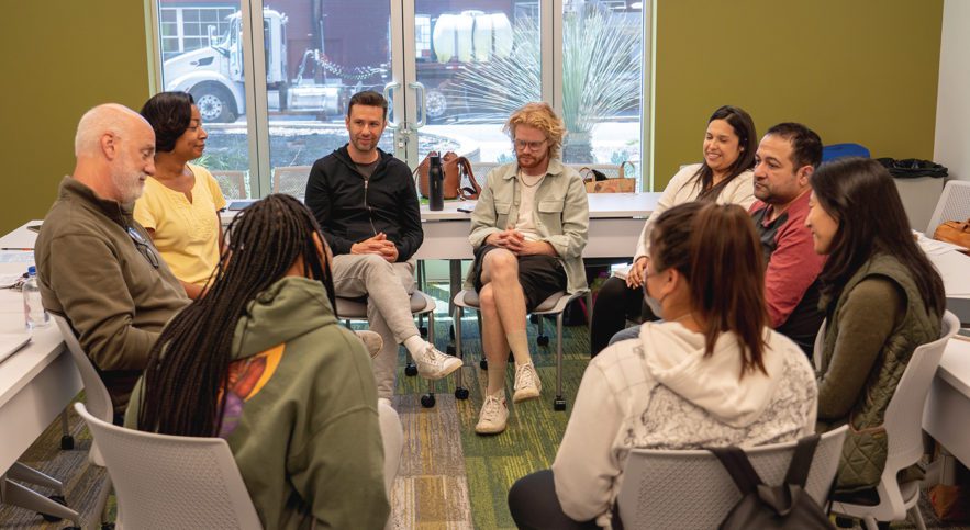 Pacific Oaks students in a circle during class