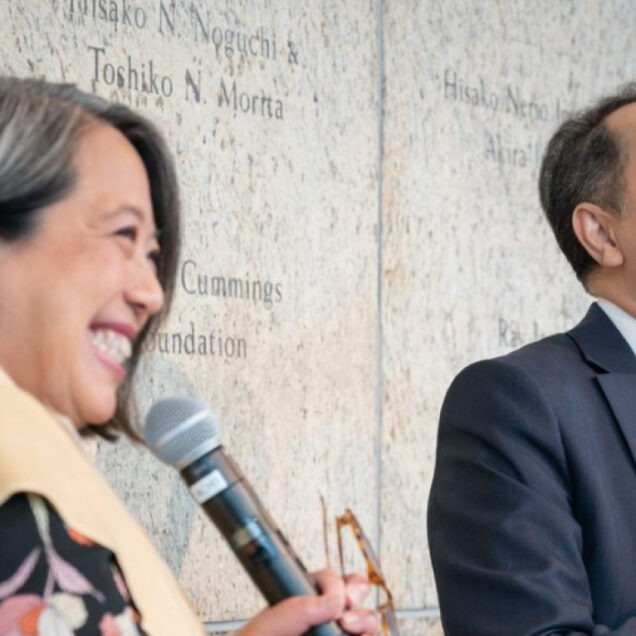 two people speaking into microphones