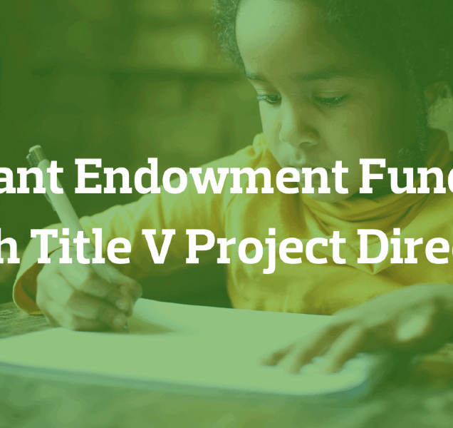 A young child writes on a piece of paper.