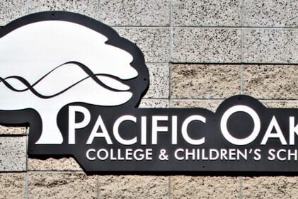 Close up of Pacific Oaks College sign on building
