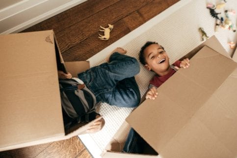 kids playing with boxes