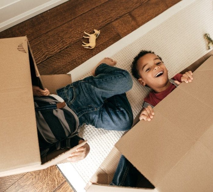 kids playing with boxes
