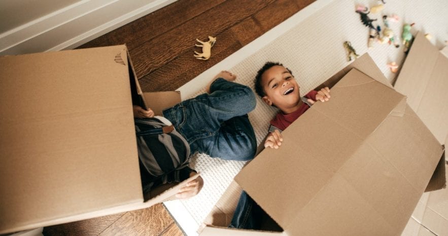 kids playing with boxes