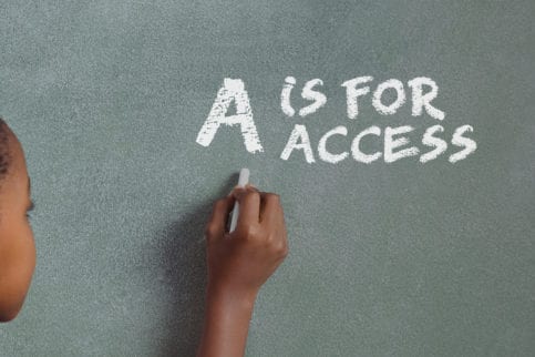 Child drawing on chalkboard, "A is for access"