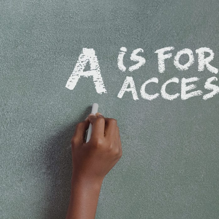 Child drawing on chalkboard, "A is for access"