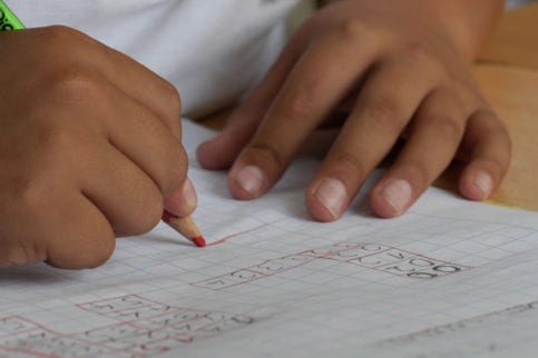 Child with pencil and paper