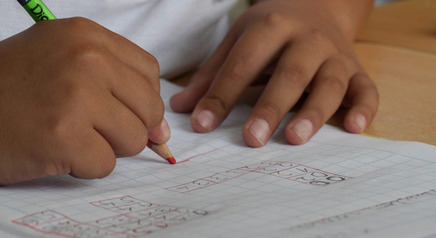 Child with pencil and paper