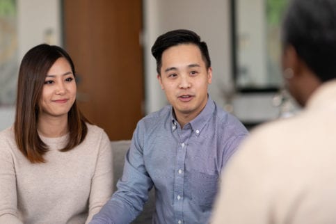 Couple sitting on couch at couple's therapy