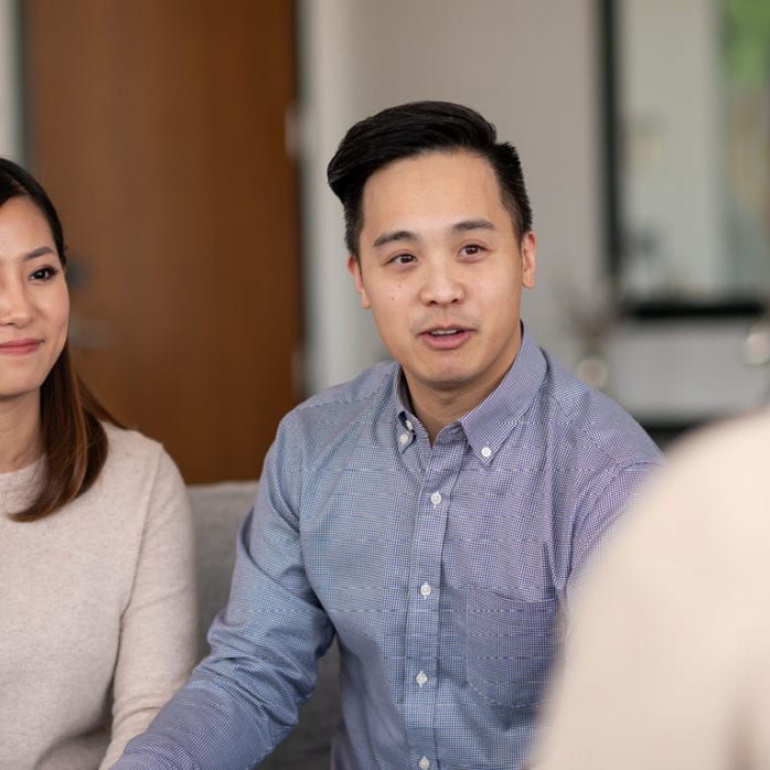 Couple sitting on couch at couple's therapy
