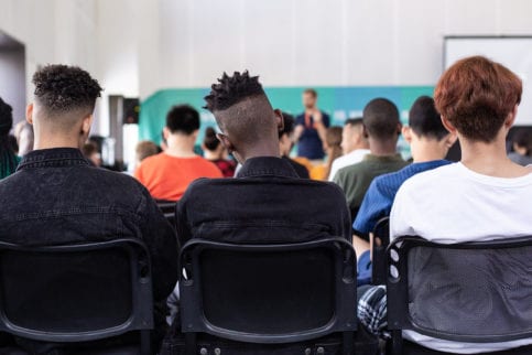 Backs of students sitting