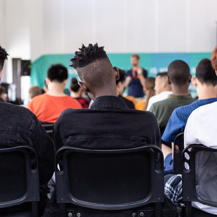 Backs of students sitting