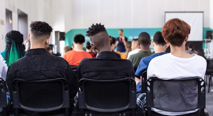 Backs of students sitting