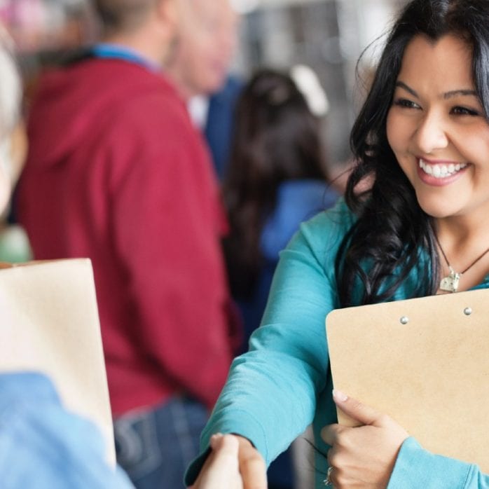 social worker meeting person in group