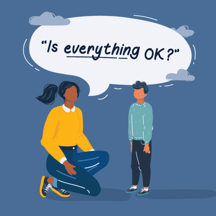 Teacher with child asking "Is everything OK?"
