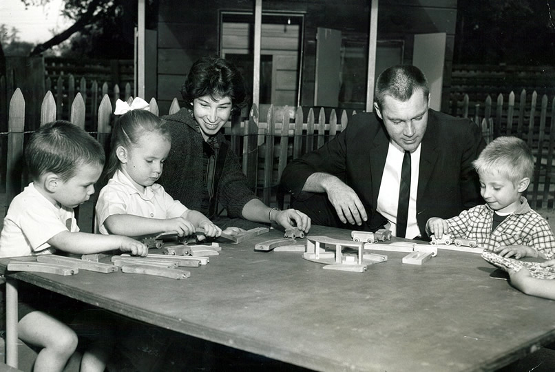 two adults with children