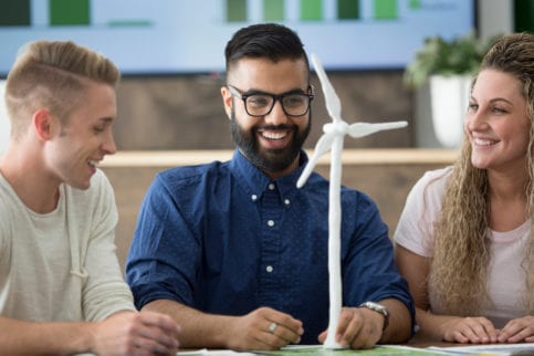 group of co-workers designing wind turbine