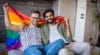 gay couple with pride flag