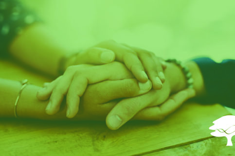 two sets of hands embracing