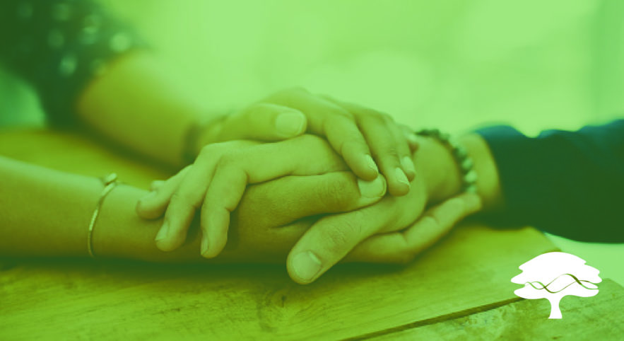 two sets of hands embracing