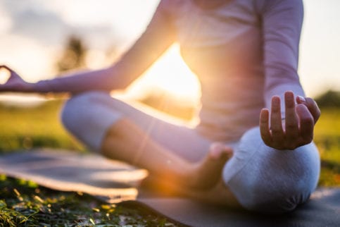 woman doing yoga pose outside