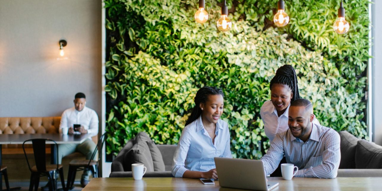 Employees happily working together