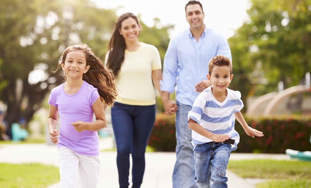 Latino family photo with parents and two kids