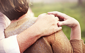 Married couple hands touching