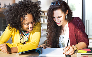 Two female students working